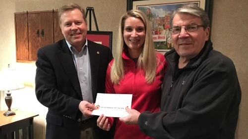 Jack Pietila Presenting a Check to Michael McGreevey and Dawn Stewart